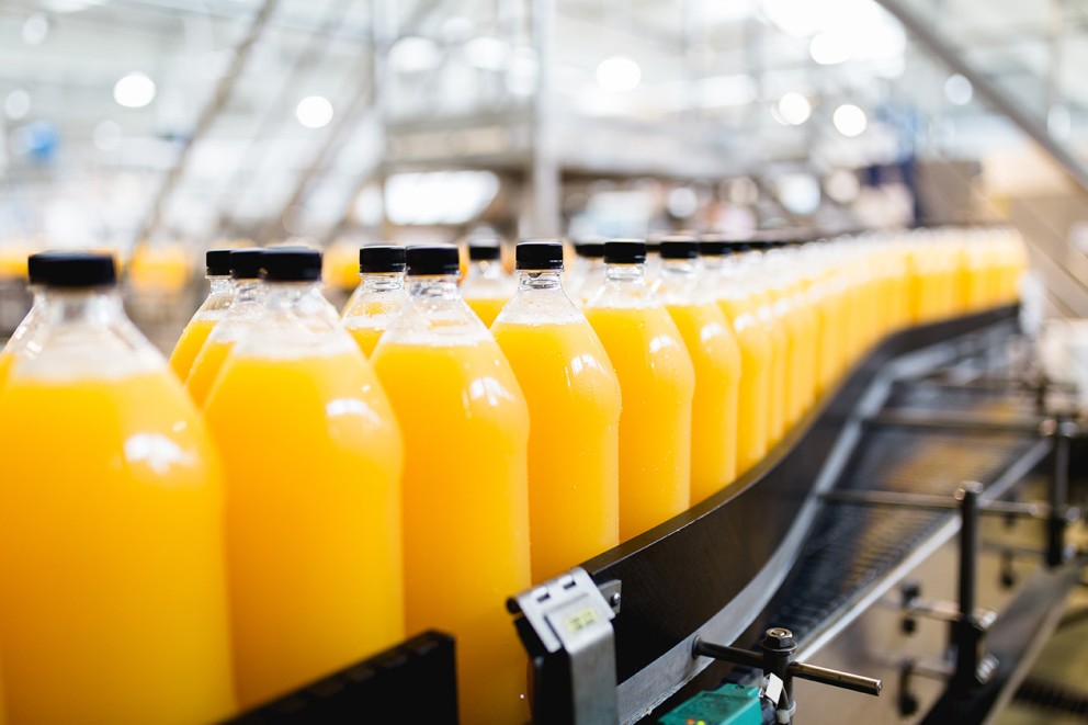 drinks lined up on conveyor belt