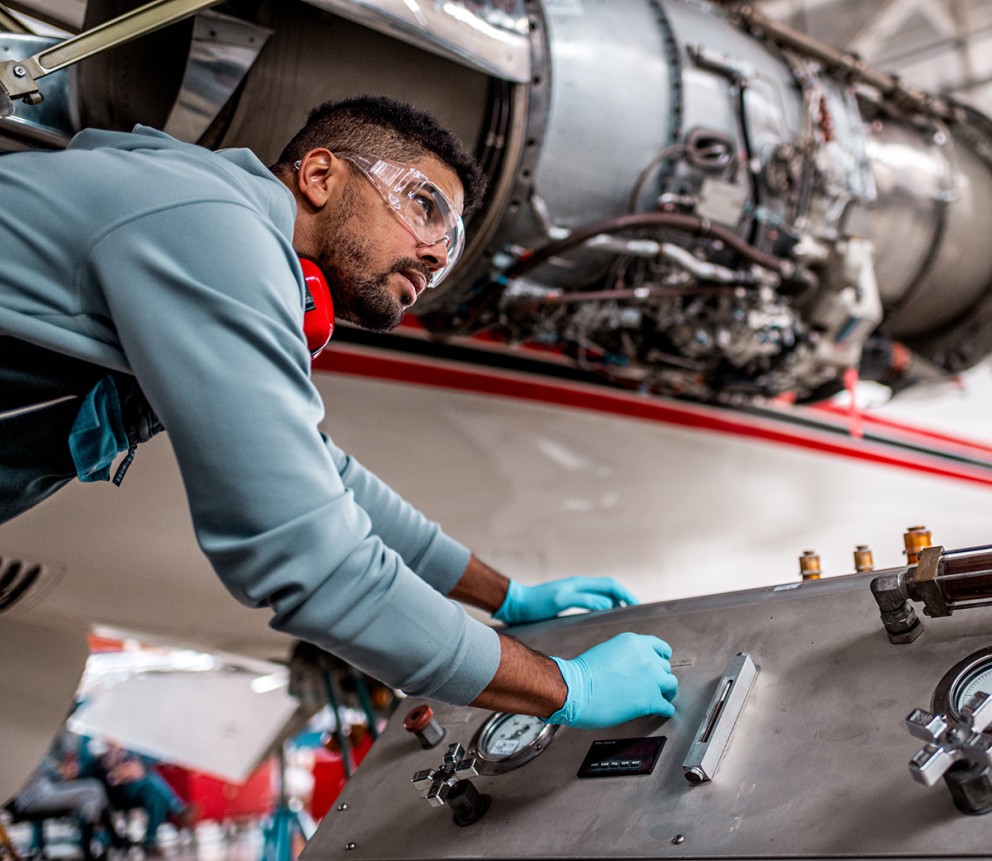 mechanic working on engine